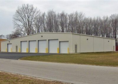 a large metal building with two doors