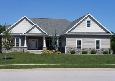 a gray house with white trim