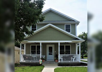 a house with a porch and white trim