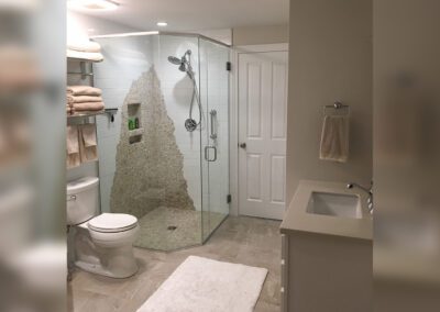 a bathroom with a glass shower stall and toilet