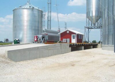 a large metal silos next to a building