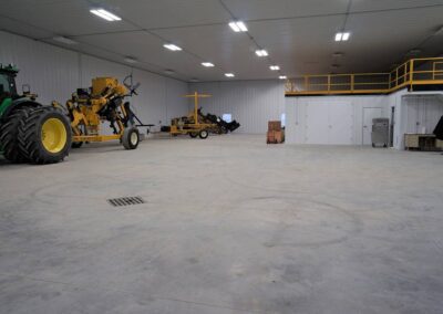 a large room with a tractor and trailer